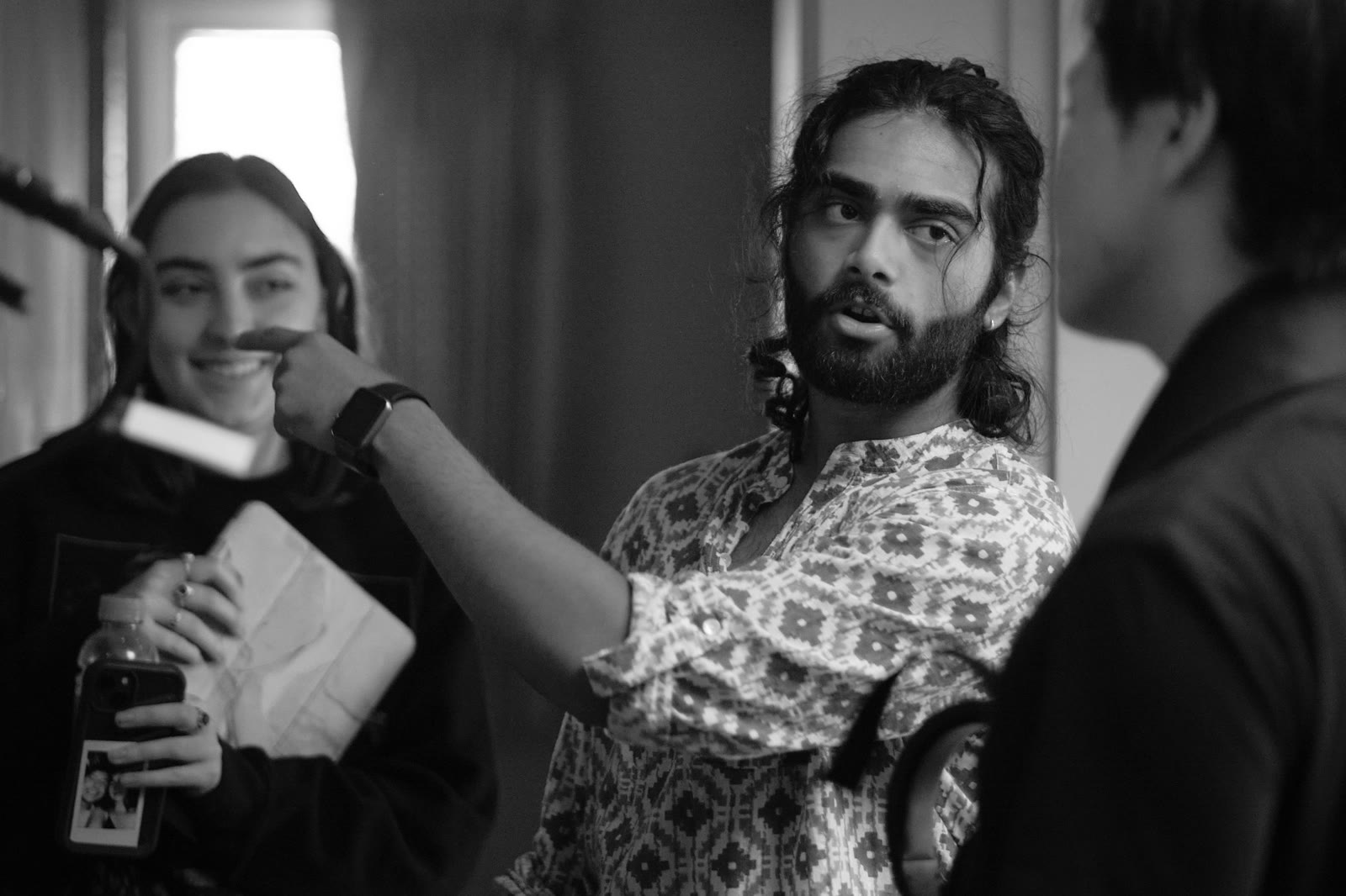 On set, behind the monitor